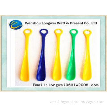 Yellow Round handled long plastic shoe horn in vivid multic